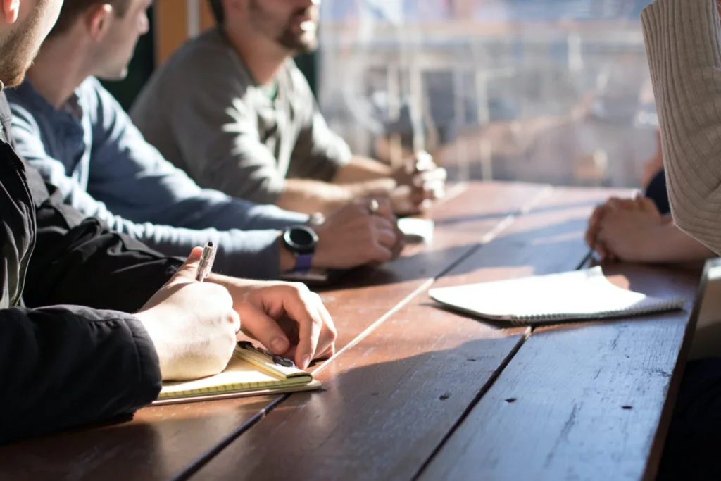 A group of people sitting together at a table