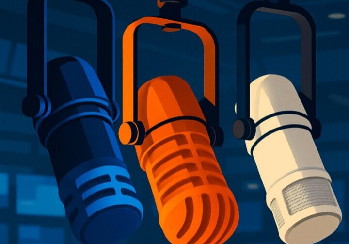A stylized illustration of three brightly colored professional microphones in blue, orange, and white placed in front of a modern newsroom background, symbolizing strategic media relations and high-credibility messaging.